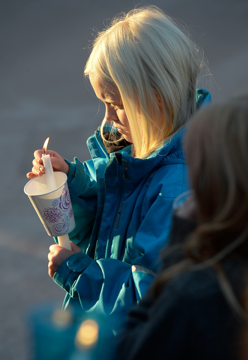 Francisco Kjolseth  |  The Salt Lake Tribune
Ashlyn Younkin, 8, holds a candle during a vigil for the Strack family at Pioneer Park in Provo after the family of five were mysteriously found dead in their Springville home last Saturday.