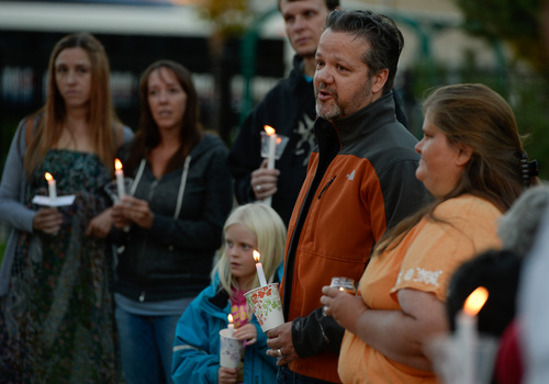 Francisco Kjolseth  |  The Salt Lake Tribune
Issac Strack, brother of Benjamin Strack, who was found dead alongside his wife and three children last Saturday at their home in Springville, thanks friends, family and many who never knew the Strack family but have shown love and support during a difficult time, as they came together for a candlelight vigil at Pioneer Park in Provo.