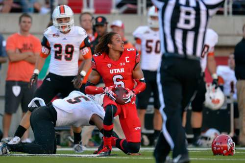 Chris Detrick  |  The Salt Lake Tribune
Utah Utes wide receiver Dres Anderson (6) looses his helmet after making a catch past Idaho State Bengals Brandon Golden (5) and Idaho State Bengals defensive back Cody Sorensen (29) during the first half of the game at Rice-Eccles stadium Thursday August 28, 2014. Utah is winning the game 35-7.