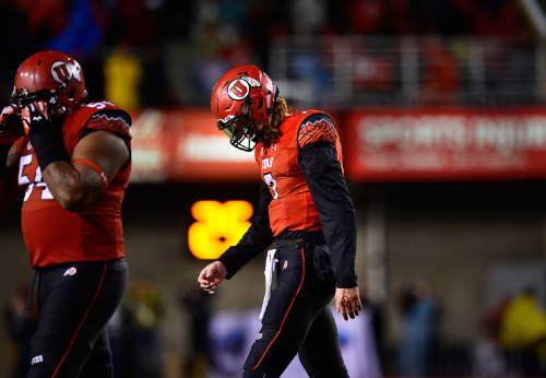 Scott Sommerdorf   |  The Salt Lake Tribune
Utah QB Travis Wilson walks dejectedly off the field after failing on a fourth down pass as Utah lost 28-27 to Washington State, Saturday, September 27, 2014.