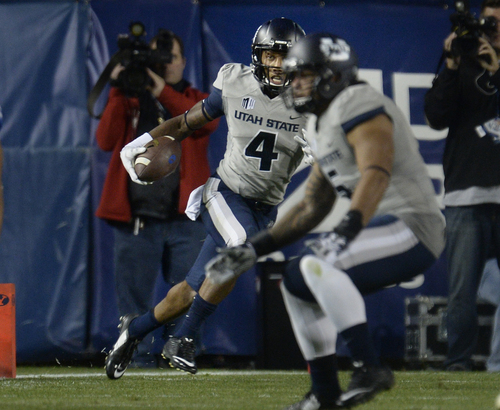 Scott Sommerdorf  |  The Salt Lake Tribune
Utah State Aggies wide receiver Hunter Sharp (4) runs during a first half play. Utah State led BYU 28-14 at the half in Provo, Friday, October 1, 2014.