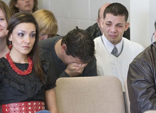 At the parole hearing of Thomas Noffsinger, the son's of Victor Aguilar, Victor (25) and Isaac (20) are overcome with emotion as they listen to the testimony of their mother as she recounts the day she had to tell her family that their father would never come home again. on  Tuesday, March 2,2010  photo:Paul Fraughton/ The Salt Lake Tribune