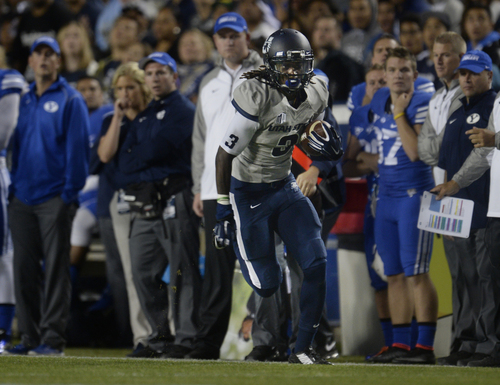 Scott Sommerdorf  |  The Salt Lake Tribune
Utah State Aggies wide receiver Devonte Robinson (3) rambles down the sideline with a pass during first half play. Utah State led BYU 28-14 at the half in Provo, Friday, October 1, 2014.