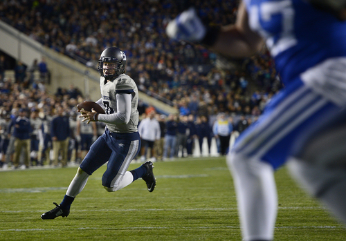 Scott Sommerdorf  |  The Salt Lake Tribune
Utah State Aggies quarterback Darell Garretson runs for a TD during first half play to tie the score at 14-14. Utah State led BYU 28-14 at the half in Provo, Friday, October 1, 2014.