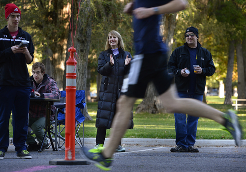 Scott Sommerdorf  |  The Salt Lake Tribune
Lynne Jackson, mother of Maddy Jackson, applauds for runners crossing the finish line of "Maddy's Run" in Liberty Park, Saturday, October 4, 2014. The 5K run/walk honors the life of Maddy Jackson, who passed away in August 2010 at the age of 18. The event benefits the Cornelia de Lange Syndrome (CDLS) Foundation and the Disability Law Center.