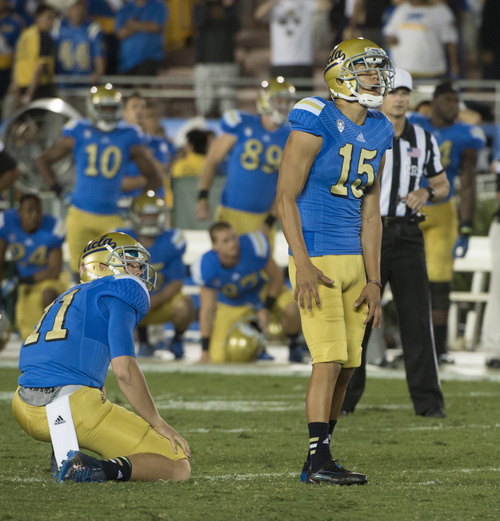 Rick Egan  |  The Salt Lake Tribune

UCLA Bruins quarterback Jerry Neuheisel (11) Bruins place kicker Ka'imi Fairbairn (15) realize the game is over, as the Fairbarin's kick is not good, with no time left on the clock, as the Utes upset UCLA 30-28  in Pac-12 action at the Rose Bowl, Saturday, October 4, 2014