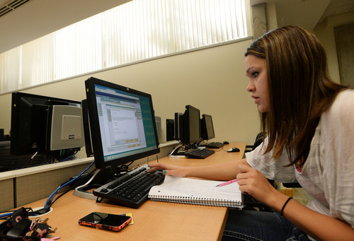 Steve Griffin  |  The Salt Lake Tribune

Monica Layton, of Taylorsville, works on her math in the Developmental Education Lab at the Salt Lake Community College Library in Salt Lake City, Thursday, September 25, 2014. The SLCC lab is used to help students who get to college behind in some subjects. Layton is working through the no credit math program to prepare her for math 1010 Intermediate Algebra which is the foundation of several of the upper math courses offered at the school.