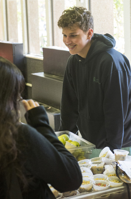 Rick Egan  |  The Salt Lake Tribune

Patrick Utzinger (right), helps out in the lunch line at City Academy in Salt Lake Thursday, Oct. 2, 2014. Utzinger, a senior at City Academy, is enrolled a job-training program for students with disabilities.