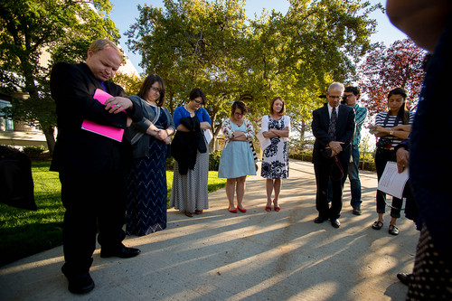 Trent Nelson  |  The Salt Lake Tribune
A group of people pray before entering a broadcast of the LDS General Conference priesthood session at BYU's Marriott Center in Provo Saturday October 4, 2014. The event was one of several planned by Ordain Women.