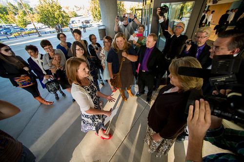 Trent Nelson  |  The Salt Lake Tribune
Abby Hansen, left, leads a group of women to the door of BYU's Marriott Center, where they are briefly stopped by volunteers Karen and Michael Roberts before being let in to watch a broadcast of the LDS General Conference priesthood session, in Provo Saturday October 4, 2014.