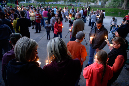 Francisco Kjolseth  |  The Salt Lake Tribune
Kaycee Neilson, left, and her sister Kolbyanne, join other friends, family and those expressing concern gather for a candlelight vigil at Murray Park for Kayelyn Louder, 30, who has been missing since Sept. 27. Surveillance footage at her Murray condo shows her leaving barefoot, in just a tanktop and shorts, into a cold, rainy evening. Murray police are investigating her disappearance, while friends and family spread fliers and awareness.