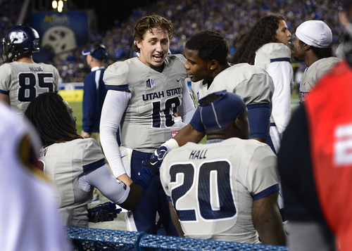 Scott Sommerdorf  |  The Salt Lake Tribune
Utah State Aggies quarterback Darell Garretson celebrates with teammates after a USU TD during first half play. Utah State led BYU 28-14 at the half in Provo, Friday, October 1, 2014.