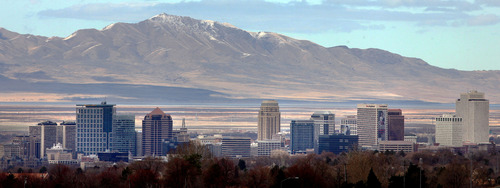 (Tribune file photo)
Antelope Island rises above the Salt Lake City skyline.
