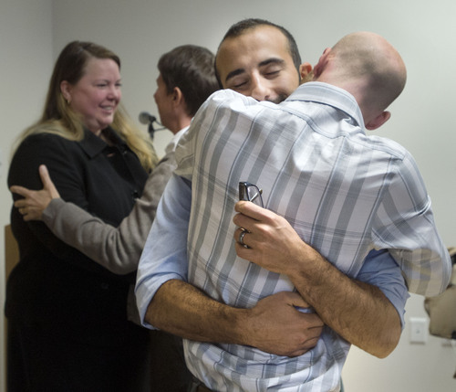 Steve Griffin  |  The Salt Lake Tribune

Derek Kitchen, right, hugs his partner, Moudi Sbeity, following a press conference at Magleby and Greenwood law offices in Salt Lake City, Monday, October 6, 2014.