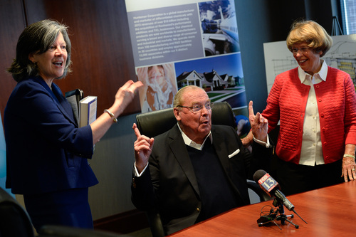 Francisco Kjolseth  |  The Salt Lake Tribune
Jon Huntsman Sr. expresses his gratitude for Mary Beckerle, CEO of Huntsman Cancer Institute, left, and his wife Karen during a press conference to announce the release of Huntsman's autobiography, "Barefoot to Billionaire," followed by a book signing at Deseret Book in downtown Salt Lake City on Friday, Oct. 3. 2014.