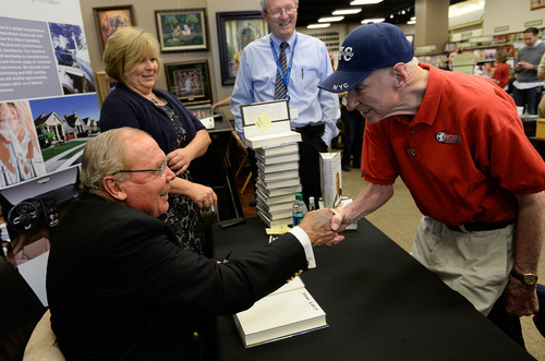 Francisco Kjolseth  |  The Salt Lake Tribune
Jon Huntsman Sr., shakes hands with John Morgan during a book signing for Huntsman's new autobiography, "Barefoot to Billionaire," at a book signing at Deseret Book in downtown Salt Lake City on Friday, Oct. 3. 2014.