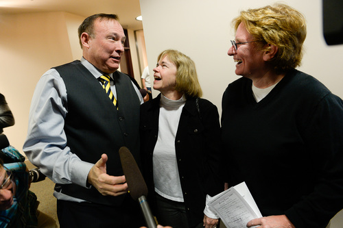 Francisco Kjolseth  |  The Salt Lake Tribune
Suzanne Marelius, center, and Kelli Frame are congratulated by Senator Jim Dabakis after becoming the first same-sex couple to apply for a marriage license at the Salt Lake County Complex on Monday morning. The U.S. Supreme Court declined to review all five pending same-sex marriage cases on Monday, Oct. 6, 2014 effectively legalizing gay and lesbian unions, clearing the way for such marriages to proceed in 11 new states - including Utah.