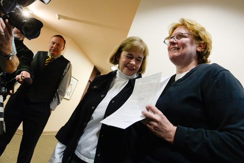 Francisco Kjolseth  |  The Salt Lake Tribune
Suzanne Marelius, center, and Kelli Frame become the first same-sex couple to apply for a marriage license at the Salt Lake County Complex on Monday morning as Senator Jim Dabakis arrives to congratulate them. The U.S. Supreme Court declined to review all five pending same-sex marriage cases on Monday, Oct. 6, 2014 effectively legalizing gay and lesbian unions, clearing the way for such marriages to proceed in 11 new states - including Utah.