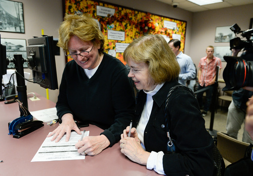 Francisco Kjolseth  |  The Salt Lake Tribune
Kelli Frame, left, and Suzanne Marelius become the first same-sex couple to apply for a marriage license at the Salt Lake County Complex on Monday morning. The U.S. Supreme Court declined to review all five pending same-sex marriage cases on Monday, Oct. 6, 2014 effectively legalizing gay and lesbian unions, clearing the way for such marriages to proceed in 11 new states ó including Utah.