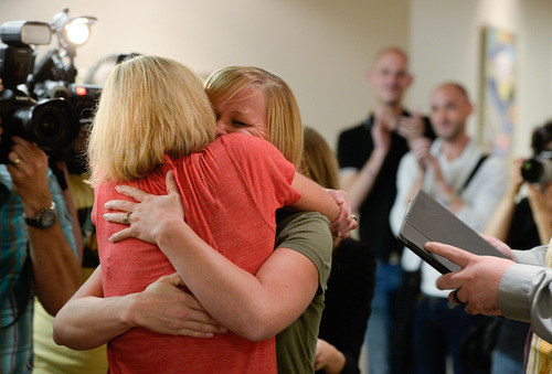 Francisco Kjolseth  |  The Salt Lake Tribune
Lynda Coleman, left, and Alisha Matthews embrace after being pronounced married at the Salt Lake County Complex on Monday. The U.S. Supreme Court declined to review all five pending same-sex marriage cases on Monday, Oct. 6, 2014 effectively legalizing gay and lesbian unions, clearing the way for such marriages to proceed in 11 new states - including Utah.