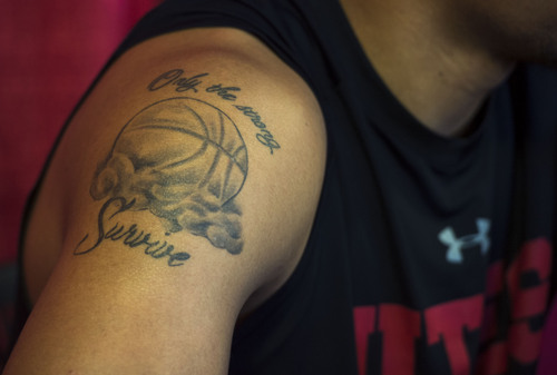 Steve Griffin  |  The Salt Lake Tribune

A tattoo on the right shoulder of Jordan Loveridge as he talks with reporters during media day at the Huntsman Center on the University of Utah campus in Salt Lake City, Monday, October 6, 2014.