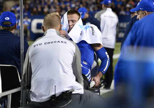 Scott Sommerdorf  |  The Salt Lake Tribune
BYU QB Taysom Hill is taken off the field on a cart after being injured on a run late in the second quarter. Utah State led BYU 28-14 at the half in Provo, Friday, October 1, 2014.