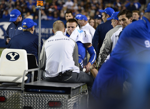 Scott Sommerdorf  |  The Salt Lake Tribune
BYU QB Taysom Hill is taken off the field on a cart after being injured on a run late in the second quarter. Utah State led BYU 28-14 at the half in Provo, Friday, October 1, 2014.