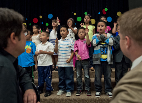 (Michael Mangum  |  Special to the Tribune)

Parkview Elementary second-graders sing as councilmen Luke Garrott, left, and James Rogers listen before the beginning of a public meeting of the  Salt Lake City Council held at Parkview Elementary School on Tuesday, October 7, 2014.