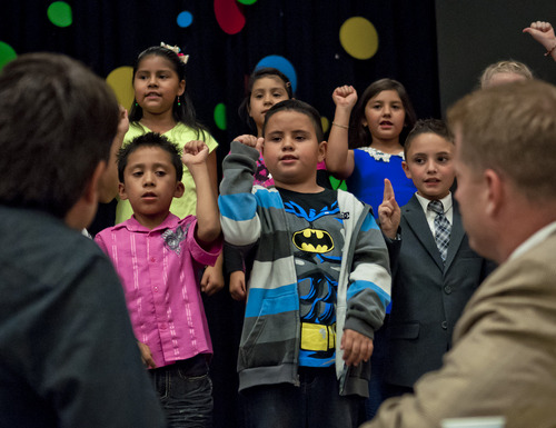 (Michael Mangum  |  Special to the Tribune)

Parkview Elementary second-graders sing as councilmen Luke Garrott, left, and James Rogers listen before the beginning of a public meeting of the Salt Lake City Council at Parkview Elementary School on Tuesday, October 7, 2014.