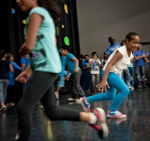 (Michael Mangum  |  Special to the Tribune)

Parkview Elementary fourth-grader Marie Folauhola, right, and classmates perform a dance before the beginning of a public meeting of the Salt Lake City Council at Parkview Elementary School on Tuesday, October 7, 2014.