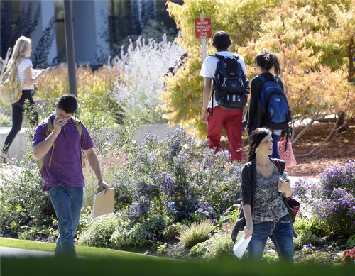 Al Hartmann  |  The Salt Lake Tribune
University of Utah students walk between classes near the Marriott Library Tuesday October 8, 2014.