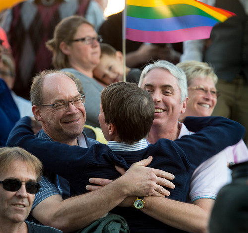 Trent Nelson  |  The Salt Lake Tribune
Kitchen v. Herbert plaintiff Kody Partridge, center, embraces Dennis Owens and Philip Jeffs during a rally to celebrate today's legalization of same-sex marriage, Monday October 6, 2014 in Salt Lake City.