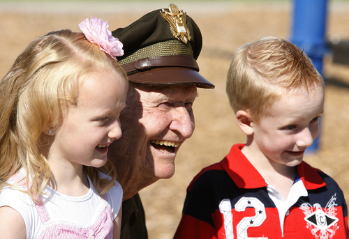 Rick Egan  | The Salt Lake Tribune 

Col. Gail Halvorsen, the "candy bomber" poses for a photo with kindergarten twins, Abbey and Bryson Bare, at Morgan elementary where he dropped 800 candy bombs in a reenactment of the historical world event, Friday, September 7, 2012.