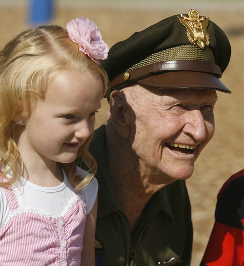 Rick Egan  | Tribune file photo 

Col. Gail Halvorsen, the "candy bomber" poses for a photo with kindergartener Abbey Bare at Morgan Elementary where he dropped 800 candy bombs in a reenactment of the historical world event, Friday, September 7, 2012.
