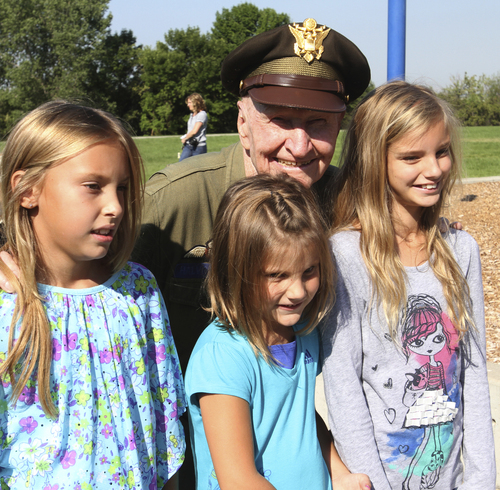 Rick Egan  | Tribune file photo 

Col. Gail Halvorsen, the "candy bomber" with his grandchildren Dylan, Emma and Aspen, students at Morgan Elementary where he dropped 800 candy bombs in a reenactment of the historical world event, Friday, September 7, 2012.