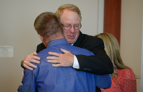 Francisco Kjolseth  |  The Salt Lake Tribune
Former West Valley City police officer Shaun Cowley, left,  receives a hug from defense attorney Paul Cassell after hearing from Judge L.A. Dever that he will not have to stand trial on Thursday, Oct. 9, 2014. Cowley is charged with second-degree felony manslaughter in connection with the Nov. 2, 2012 fatal shooting of 21-year-old Danielle Willard.