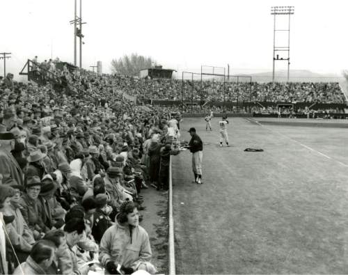 Tribune file photo

A player signs autographs for fans at Derk's Field is seen in this undated photo.