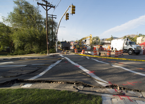 Rick Egan  |  The Salt Lake Tribune

Crews work on a water main at the intersection of 1700 South and Foothill Drive, Saturday, October 11, 2014