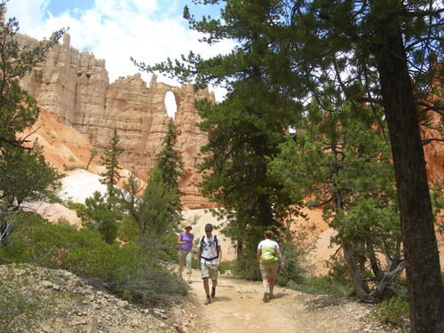 Tribune file photo
Hikers walk along the Peakaboo Trail in Bryce Canyon National Park. One of The Windows can be see above.