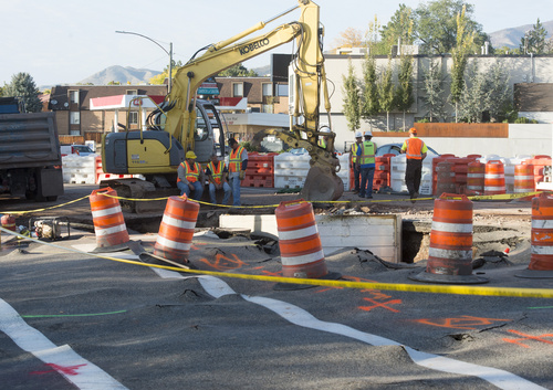 Rick Egan  |  The Salt Lake Tribune
Crews work on a water main at the intersection of 1700 South and Foothill Drive on Saturday.
