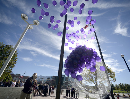 IAl Hartmann  |  The Salt Lake Tribune
In honor of Domestic Violence Month, 272 purple balloons were released representing vicitms of domestic violence in Sandy last year in a ceremony Tuesday, October 14 at Sandy City Justice Court building.  The ceremony was to raise awareness and to remember the victims of domestic violence.