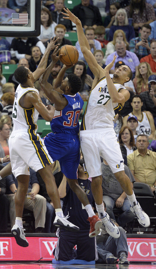 Rick Egan  |  The Salt Lake Tribune

Utah Jazz guard Rodney Hood (5) is called for a foul as he and Rudy Gobert (27)  try to stop Los Angeles Clippers guard C.J. Wilcox (30), in pre-season NBA action, Utah Jazz vs. The LA Clippers at EnergySolutions Arena, Monday, October 13, 2014