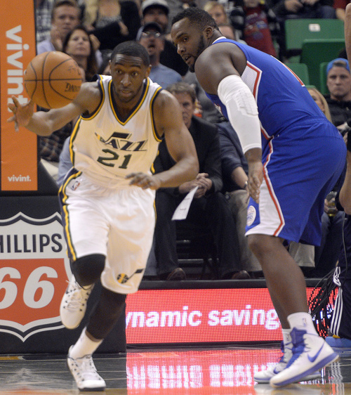 Rick Egan  |  The Salt Lake Tribune

Utah Jazz guard Ian Clark (21) heads down court after stealing the ball from Los Angeles Clippers forward Glen Davis (0), in pre-season NBA action, Utah Jazz vs. The LA Clippers at EnergySolutions Arena, Monday, October 13, 2014