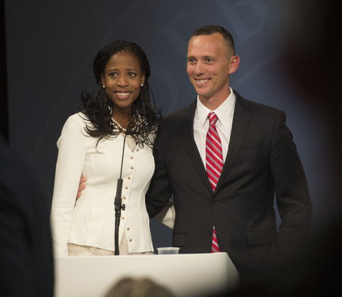 Steve Griffin  |  The Salt Lake Tribune


Mia Love stands with her husband, Jason Love, after debating Doug Owens, in Utah's premier congressional matchup in the 4th district at the Dolores Doré Eccles Broadcast Center on the University of Utah campus in Salt Lake City, Tuesday, October 14, 2014.
