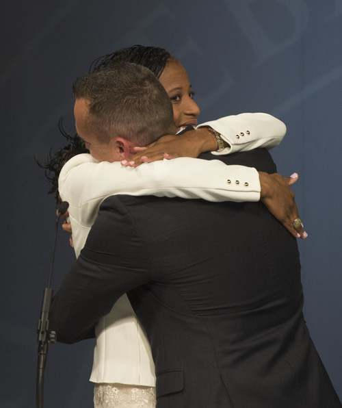 Steve Griffin  |  The Salt Lake Tribune


Mia Love is hugged by her husband  Jason Love after debating Doug Owens, in Utah's premier congressional matchup in the 4th district at the Dolores Doré Eccles Broadcast Center on the University of Utah campus in Salt Lake City, Tuesday, October 14, 2014.
