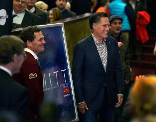 Scott Sommerdorf   |  The Salt Lake Tribune
Mitt Romney poses for photos with Greg Whiteley, left, the Director of "Mitt" as he arrives at the Sundance Salt Lake City Gala featuring the documentary "Mitt" at the Rose Wagner Theater in Salt Lake City, Friday, January 17, 2014.