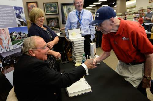 Francisco Kjolseth  |  The Salt Lake Tribune
Jon Huntsman Sr., shakes hands with John Morgan during a book signing for Huntsman's new autobiography, "Barefoot to Billionaire," at a book signing at Deseret Book in downtown Salt Lake City on Friday, Oct. 3. 2014.