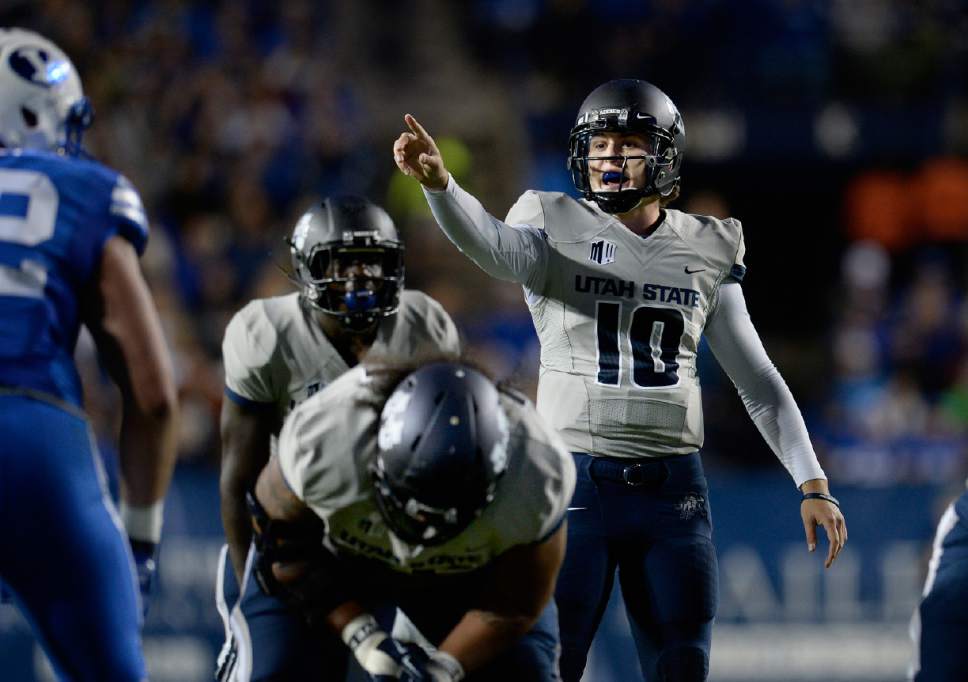 Scott Sommerdorf  |  The Salt Lake Tribune
Utah State Aggies quarterback Darell Garretson (10) shouts directions to his offensive line during first half play. Utah State led BYU 28-14 at the half in Provo, Friday, October 1, 2014.