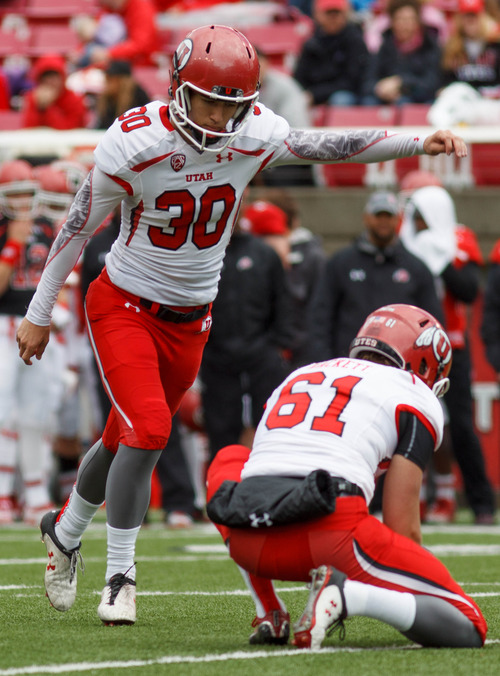 Trent Nelson  |  The Salt Lake Tribune
Kicker Jamie Sutfcliffe attempts a point after kick during the University of Utah's Red-White Spring football game, Saturday April 20, 2013 in Salt Lake City. Holding the ball is Tom Hackett.