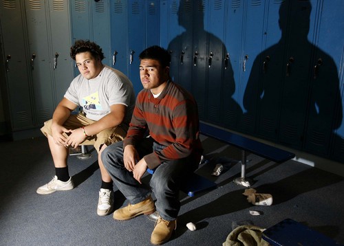 South Jordan - Bingham High School football players Derek Tuimauga (left) and Iona Pritchard are cousins who are going to play for in-state rivals BYU (Pritchard) and the University of Utah (Tuimauga). They were photographed in locker room at Bingham,Thursday, January 24, 2008.
Trent Nelson/The Salt Lake Tribune; 1.24.2008